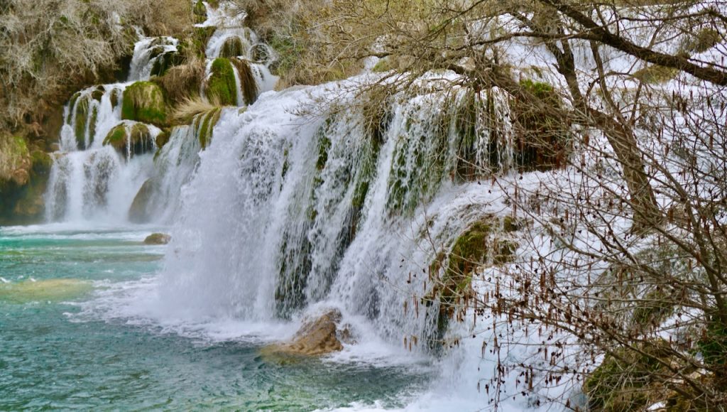 Notice the vegetation present under the cascading water.